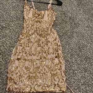 gold sequins dress with an open back.